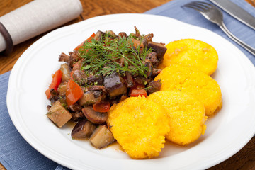 Wall Mural - Polenta slices with vegetable stew