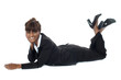 © stockyimages - Corporate woman lying on floor, smiling