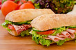Pair of sandwiches filled with various ingredients
