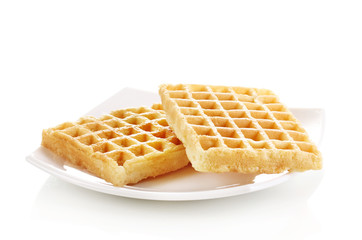 Wall Mural - Sweet waffles on plate isolated on white