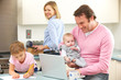© Monkey Business - Family busy together in kitchen