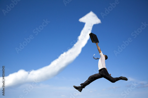 jumping businessman with business growing graph cloud Poster