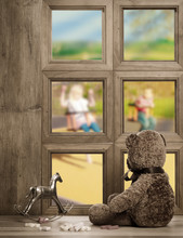 Teddy Bear Left Behind Watches From The Window As Children Play
