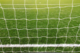 Fototapeta Londyn - soccer net on green grass