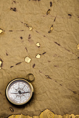old style compass and paper background