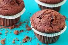 Chocolate Muffins On A Blue Background