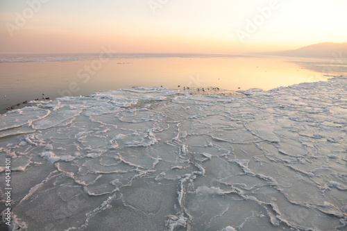 Sunset on the sea - ice - floe. Poland, Gdynia