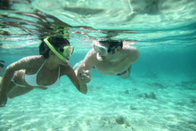 Couple Snorkeling In Caribbean Waters