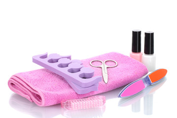 Pedicure set on pink towel isolated on white