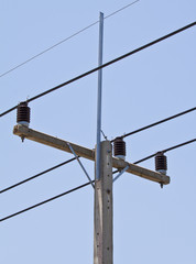 electricity post in blue sky