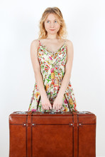 Girl With Vintage Suitcase Anticipating Travel