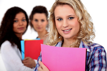 Students stood with folders