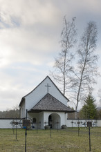 Black Death Graveyard Chapel With Crosses And Huge Birch Trees