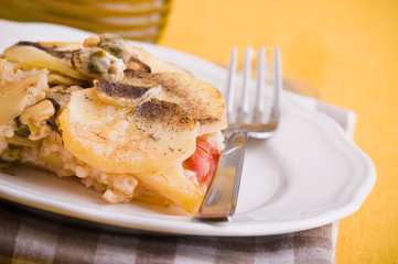 Rice, potatoes and mussels. Tiella di riso, patate e cozze.