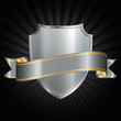 Silver shield with a shiny silver ribbon on a grunge background.