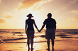 © EpicStockMedia - Senior Couple Enjoying Sunset at the Beach