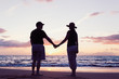 © EpicStockMedia - Senior Couple Enjoying Sunset at the Beach