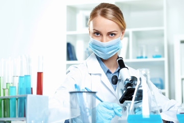 Wall Mural - Young scientist working in laboratory