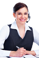 Wall Mural - Young business woman with headset.