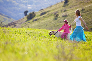 Wall Mural - Happy family walking with dog