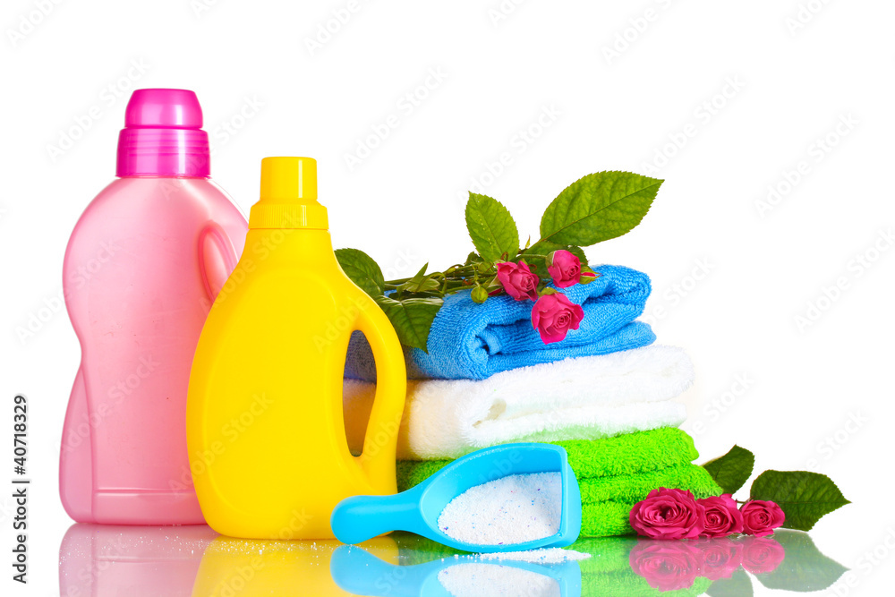 Detergent with washing powder and towels isolated on white
