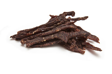 Wall Mural - South African biltong strips  isolated on a white background