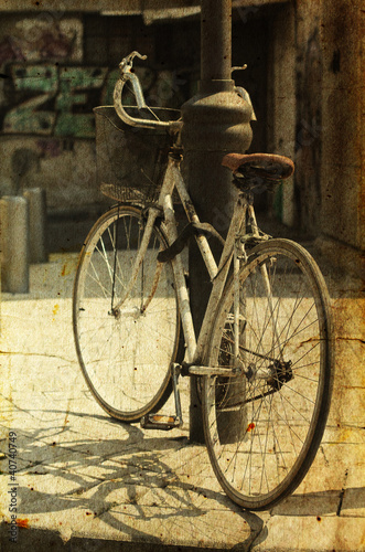 Obraz w ramie old bicycle. Photo in old image style.