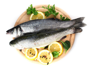 fresh fishes with lemon, parsley and spice