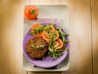 Wall Mural - soy steak with arugua and tomatoes salad