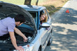 © CandyBox Images - Car troubles couple starting cables vehicle