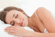 © WavebreakmediaMicro - Woman in bed, sleeping and smiling softly