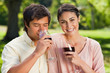 © WavebreakmediaMicro - Woman smiling while her friend is drinking wine