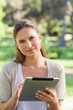 © WavebreakmediaMicro - Woman with a tablet computer in the countryside