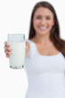 © WavebreakmediaMicro - Glass of milk being held by a young brunette woman