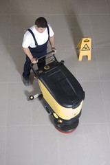 Wall Mural - cleaning floor with machine