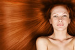 © koji6aca - woman with long healthy shiny red hair