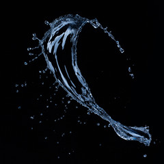 Wall Mural - water splash isolated on black background