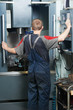 worker at machining tool workshop