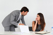 © goodluz - Businessman in office harassing young woman