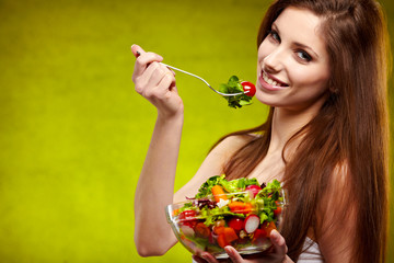 female of cute appearance eats vegetable vegetarian salad