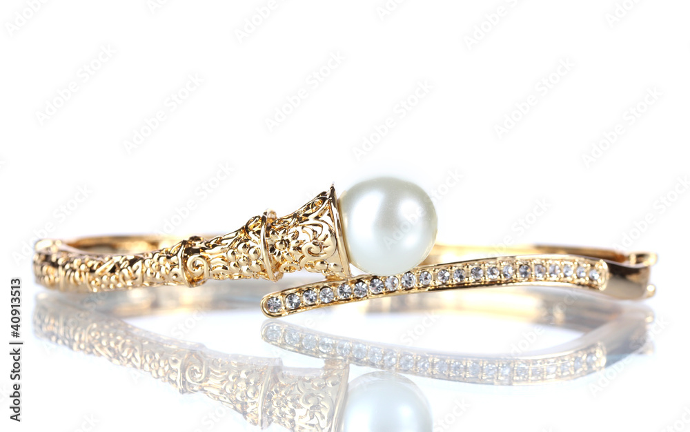 Beautiful golden bracelet with pearl on isolated on white
