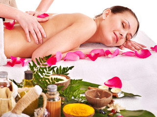 Woman getting massage in spa.