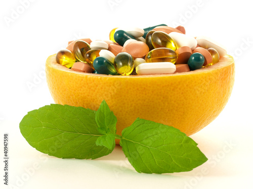 Fotografie, Obraz Concept shot with vitamin pills in a grapefruit