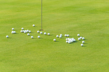 Group Of Practice Golf Ball On Green