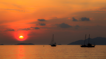 Wall Mural - sailing boat sunset at sunset beach koh lipe