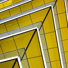 yellow sharp angled corner of a building abstract