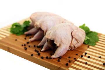 fresh carcasses of partridges on a white background