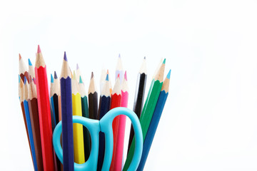 Close up of color pencils with different color over white backgr