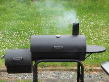 Backyard Barbequing On A Charcoal Smoker