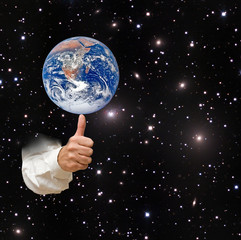 Wall Mural - Planet earth on finger.Elements of this image furnished by NASA